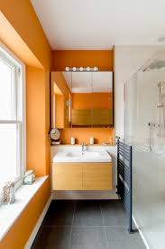A Bold Orange Bathroom Will Perk Up Your Day Orange Bathrooms Orange Bathrooms Designs Bathroom Colors