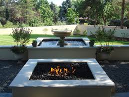 This concrete propane fire pit will add warmth and contemporary style to any outdoor living space. Outdoor Fireplaces Fire Pits Denver Landscapes