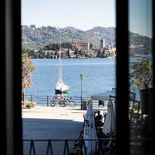 Catch A Glimpse Of Lake Orta From The Casa Fantini Window Our Boutique Hotel In Italy On The Shores Of Lake Orta Lake Time Boutique Hotel Lake