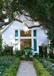 Because this style feels ornate, a formal living or dining room may feel appropriate. French Tudor Style House Painted Grey Landscaping Mark D Sikes The Glam Pad