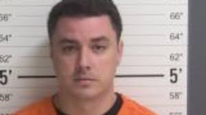 Former Clovis police officer turns himself in after arrest warrant issued