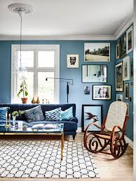 The symmetrical design relies on two matching, contrasting pieces of furniture that frame a large, comfortable couch. 35 Blue Living Rooms Made For Relaxing