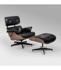 The barrel chair features a classic rounded back with flared arms that are stuffed with foam for a supported seat. Replica Eames Chair And Ottoman Black Leather Loungers