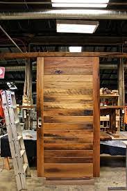 The great thing about these planks is that they are light as a feather and they secure to one another because this wood is sooooo thin and because it is tongue and groove and sticks together i didn't worry about the ends of the planks aligning with a stud. Tongue Groove Door Horizontal Boards Entry Doors Doors Family Living Rooms