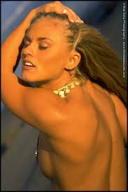 Sexy blonde with an ass to die for Tina Rigdon models swimwear at the beach  - Pichunter