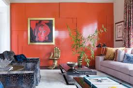 Chic pastel orange carpeted living room with light gray sofa, a fireplace, and stylish pillows. 40 Orange Living Room Ideas Photos Home Stratosphere