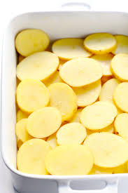 Ingredients 1 large russet potato,sliced ⅛ inch thick 2 thin slices of onions, halved 1 garlic clove (crushed) Scalloped Potatoes Gimme Some Oven