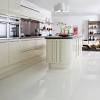 In this kitchen, the dark wood of the flooring and the island is perfect for creating an almost traditional feel that contrasts the eager, bright and fresh look of the white kitchen. 1