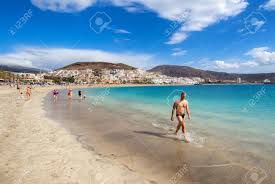 Canary islands, autonomous community of spain, established on august 10, 1982, by statute of autonomy and consisting of an archipelago in the atlantic ocean off the coast of northwest africa. Tenerife Canary Islands January 09 2015 People Relaxing On The Las Americas Beach One Of The Most Popular And Well Known Resorts In Tenerife Canary Islands Spain Stock Photo Picture And Royalty