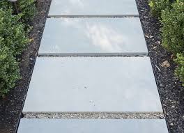 Modern smooth concrete edging for sleek garden beds and driveway borders. Hardscaping 101 Metal Landscape Edging