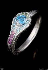 Peacock Engagement Ring Inspired By Their Lustrous Tails And Iridescent Colors This Vibrant Ring Is Sure Engagement Rings Textured Ring Peacock Feather Ring