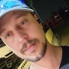 Does the coney dog come with a side at Robbie's Gourmet Sausage Co.?