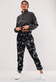 Pour 1/2 bottle or 1 box of rit powdered dye into 4 cups of hot water. Gray Tie Dye 90s Joggers Missguided