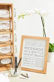 Acting as a guest book alternative, this personalized bottle wedding wishes guest book is a creative way to involve wedding guests in the festivities. Check Out This Diy Message In A Bottle Guest Book Wedding Guest Book Sign Wedding Bottles Diy Guest Book