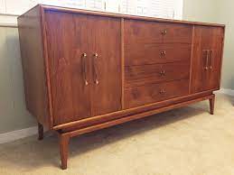 This gorgeous piece is crafted with a walnut veneer frame and panels plus brushed gold stainless steel legs for a. Vintage Mid Century Modern Walnut Credenza With Drawers Cabinets Epoch