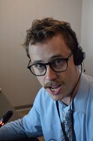 strange man w bicolored sideburns playing charly garcia in the 80s