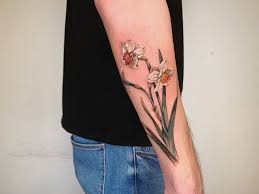 Daffodil flower tattoos birth flower tattoos flower wrist tattoos dainty tattoos flower tattoo designs pretty tattoos symbolic tattoos cute explore wicked flower tattoo designs with the top 37 daffodil tattoos. Top 37 Daffodil Tattoo Ideas 2021 Inspiration Guide