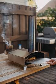 Nothing beats the smoky flavor that an outdoor wood fired pizza oven delivers. Our Ooni Pizza Oven Honest Review Tips Tricks Plays Well With Butter