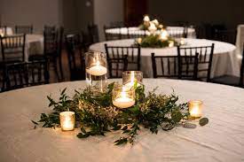 Floating Candles And Greenery So Simple Yet So Elegant Floating Candles Pool Candles Suspended Candles