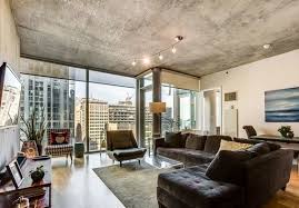 Modern Living Room With Concrete Ceilings Floor To Ceiling Windows Hardwood Floors Black Sue Floor To Ceiling Windows Modern Living Room Rugs In Living Room