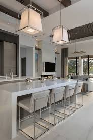 Contemporary cabinetry with stainless fixtures against dark wood make up the design of this luxury kitchen. 75 Beautiful Double Island Kitchen Pictures Ideas Houzz
