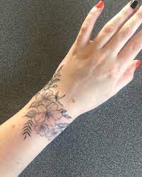 A band around the wrist is an ideal choice since it can look elegant and classy as well. My Wrap Around Wrist Of Flowers Done By Laura MorkunaitÄ— At Ink Factory Kaunas Lithuania Tattoo Lover Family