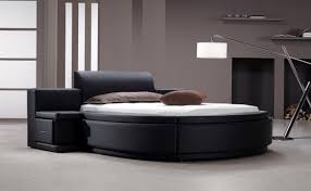 The round bed for some reason lures you at least a little to lie down, relax and enjoy. Owen Black Leatherette Round Bed W Storage