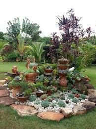Lovely Little Island Of Succulents In A Tropical Landscape Serragardens Succul In 2020 Tropical Landscaping Rock Garden Landscaping Succulent Rock Garden