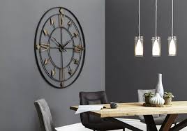 Minimalistic splendour of a white and gold living room with a dining area and a kitchenette. Grey Dining Room Ideas Furniture Village