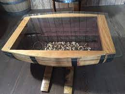 Find yourself a used wine barrel (you'll actually need two for a 5ft x 2.5ft top). Glass Top Wine Barrel Coffee Table Without Wine Racks Live Oak Wine Decor