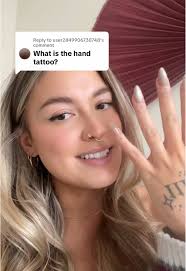 Mads Lewis Hand Tattoo