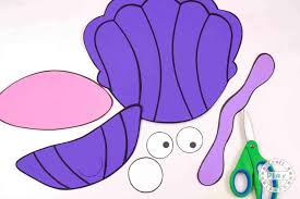 You'll need shells, yarn in various colors, glue, paint, and glitter. Easy Kids Clam Shell Ocean Craft The Inspiration Edit