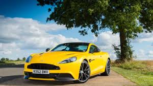 Image result for Sunburst Yellow 2012 Aston Martin