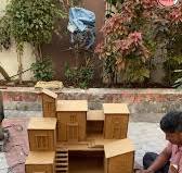 Building a miniature model of a dream house with cardboard ...