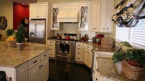 Over the years, many different themes of decorating have come and gone. Cream Cabinets Dark Wood Floors Love Off White Cabinets With Dark Wood Floors White Modern Kitchen Off White Kitchen Cabinets Antique White Kitchen Cabinets