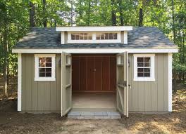 Main benefit is extra overhead storage sp Our New Amish Built Storage Shed Promises To Solve Our Garage Disorganization And Our Backyard Landscaping Iss Shed Landscaping Backyard Storage Backyard Sheds