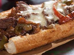 Steak sandwiches are sometimes served with toppings of cheese, onions, mushrooms, peppers, tomatoes. Steak Bomb Traditional Sandwich From New England United States Of America