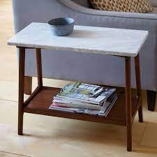 Its open bottom shelf offers space for a basket, books or a vase. Reeve Mid Century Side Table Marble