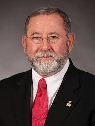 Behind Pinehurst's golfing greats, you find the caddies