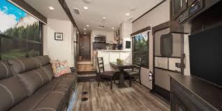 A bunkhouse travel trailer has all of the amenities of campers or rvs—kitchen, dinette, living space, and bathroom—with two separate spaces for sleeping areas. The Top 9 Travel Trailers With 2 Bathrooms Of 2021