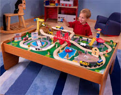 The waterfall junction train set & table pairs one of our sturdy train tables with an interactive train set. Amazon Com Kidkraft Ride Around Town Wooden Train Set And Table With Helicopter Airplane Farm Storage Bins And 100 Pieces Compatible With Other Major Brand Trains Honey Gift For Ages 3 Toys