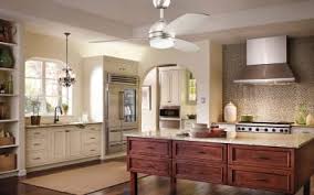 Beautiful kitchen has white cabinetry and large block of counter space. How To Choose A Ceiling Fan