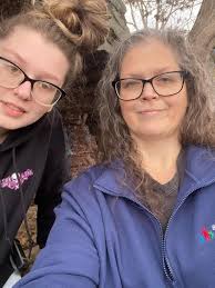 Can someone edit this photo to remove the girl in the lighter blue hoodie  and add a hug between me and my uncle?