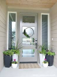 Giant clay front door flower pot design a huge clay pot needs to make a big but simple statement, so fill this one with great masses of pink and palest pink petunias. Front Porch Planter Ideas Get Your Porch Ready For Spring