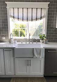 Modern Farmhouse With Farmhouse Sink And Custom Made Striped Roman Shade White Cab White Kitchen Curtains Kitchen Window Treatments Farmhouse Kitchen Curtains