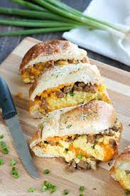 This Breakfast Stuffed French Bread Is Like A Huge Breakfast Sandwich Stuffed With Soft Scrambled Eggs Meaty Sandwich Recipes Dinner French Bread Dinner Bread