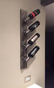If your wine rack is on show in the kitchen or dining space, choosing something that creates a statement style piece is an ideal option. Industrial Modern Wall Wine Rack Unique Vertical Wall Etsy