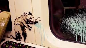 New banksy art encourages face masks on london tube. Banksy Unveils New Pandemic Inspired Art Featuring Rats In Face Masks