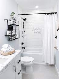 This blue and white bathroom is accessorized in blue. Hallway Bathroom Facelift In 2020 Bathroom Inspiration Tan Bathroom Grey Floor Tiles White Bathroom Decor Bathroom Interior Design Bathroom Interior