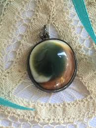 Join prime to save $2.00 on this item. Antique Operculum Pendant Victorian Sterling Silver Evil Cats Eye Snail Shell Necklace Gothic Art Nouveau Jewelry Shell Jewelry Jewelry